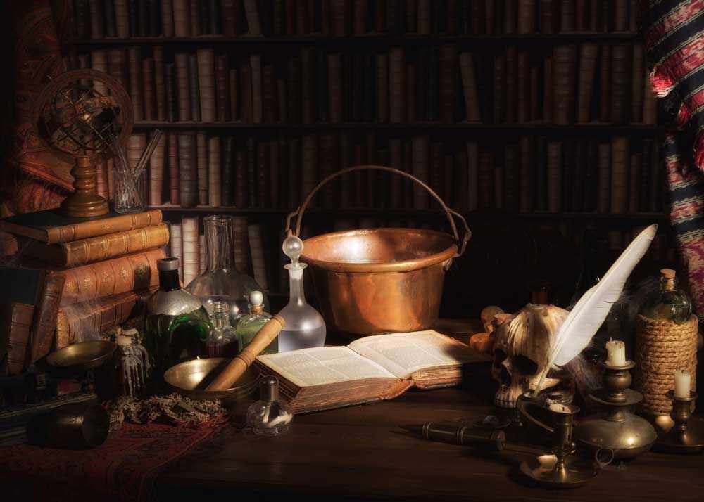 An 18th Century alchemist's kitchen, featuring a copper pot, beakers, books, and notes